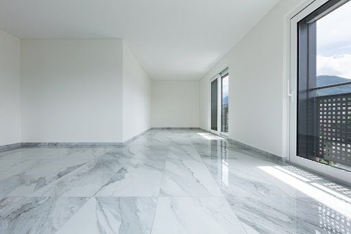 Budownictwo interior of empty apartment, wide room with marble floor